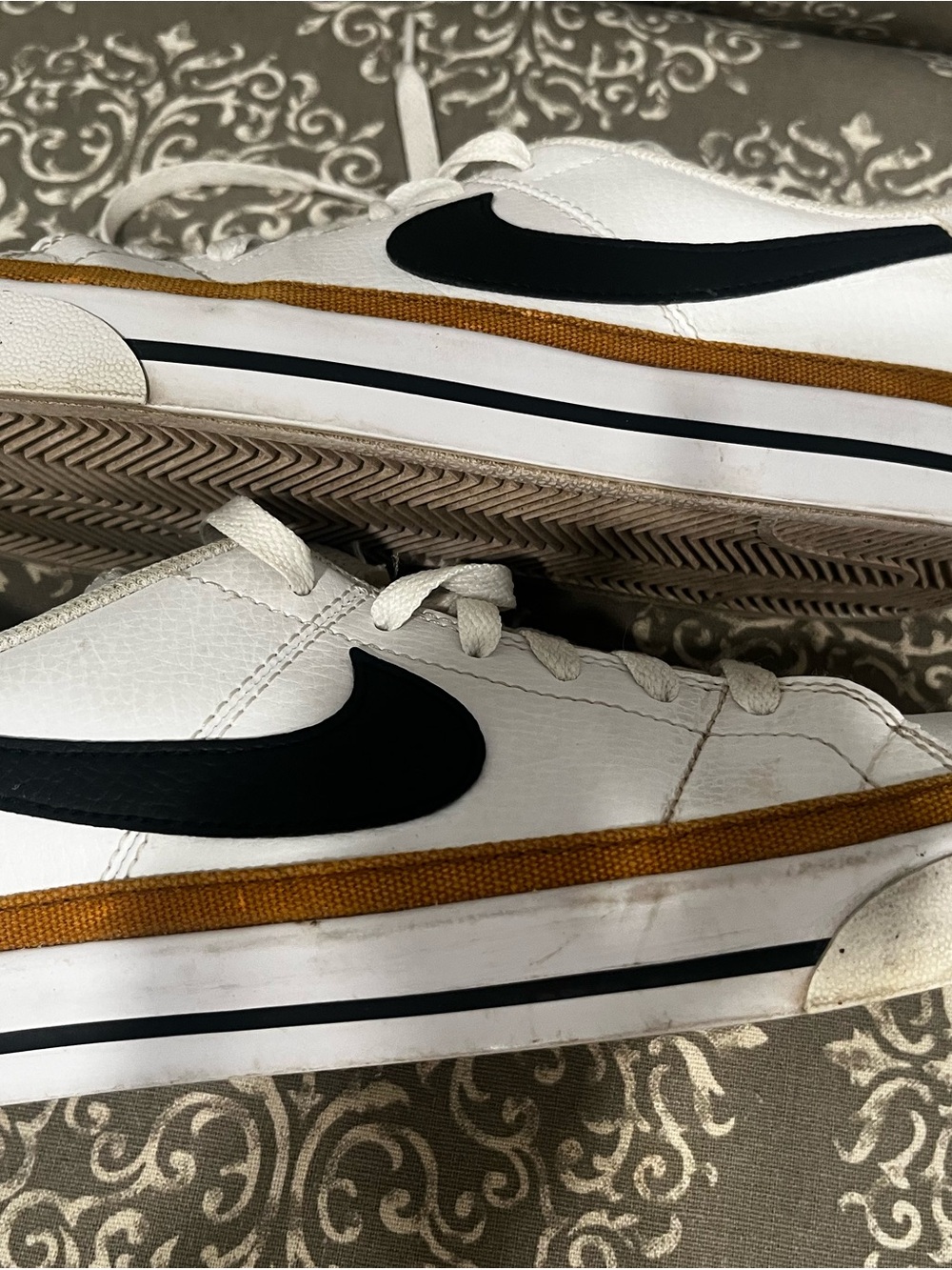 Nike White Sneakers with Black Swoosh and Gold Trim